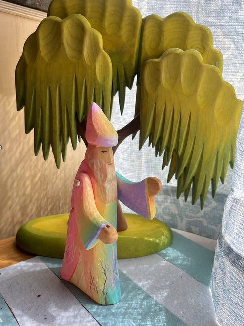 Hand-painted wooden rainbow wizard in pastel sunrise colors