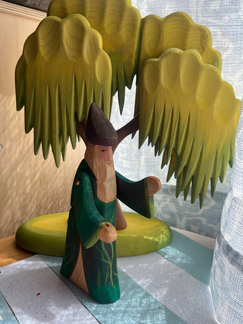 Hand-painted wooden forest wizard in deep green robes