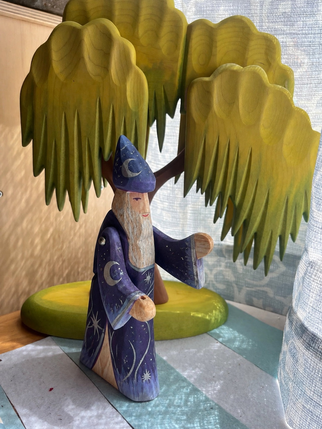 Hand-painted wooden wizard in deep blue with moons and stars
